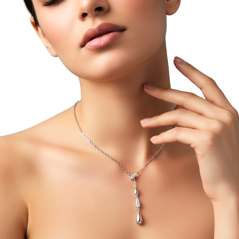 Woman wearing a silver necklace with a pendant on a white background
