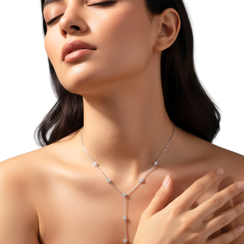 Woman wearing a delicate necklace on a white background
