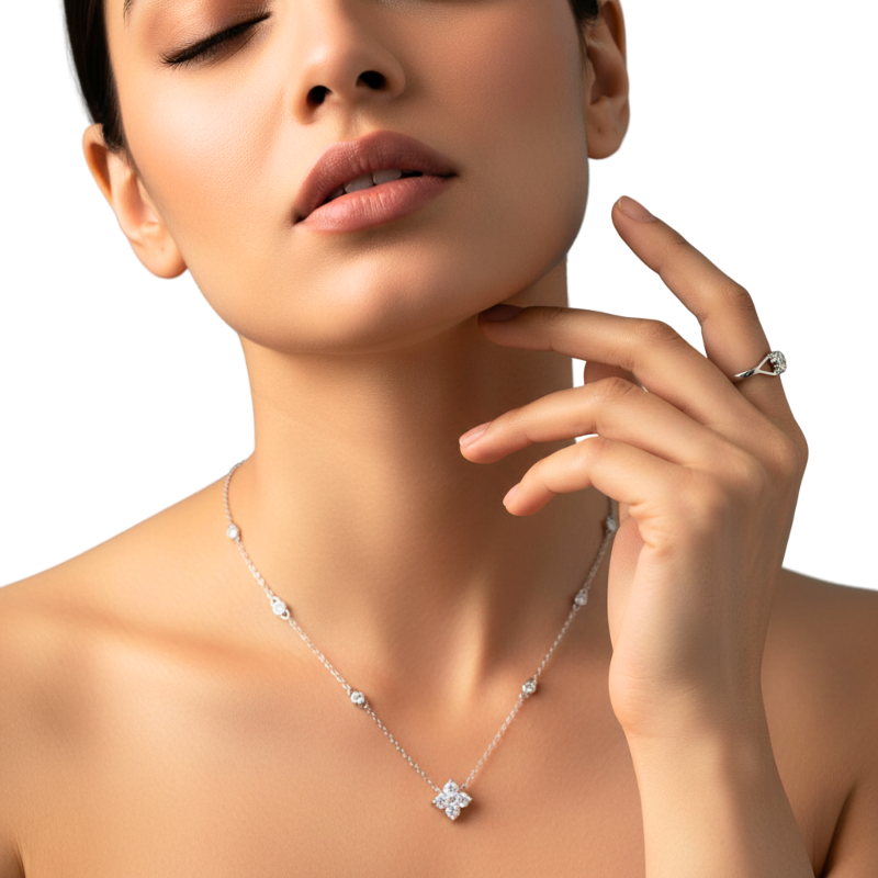 Close-up of a woman wearing a silver necklace with a diamond pendant on a white background