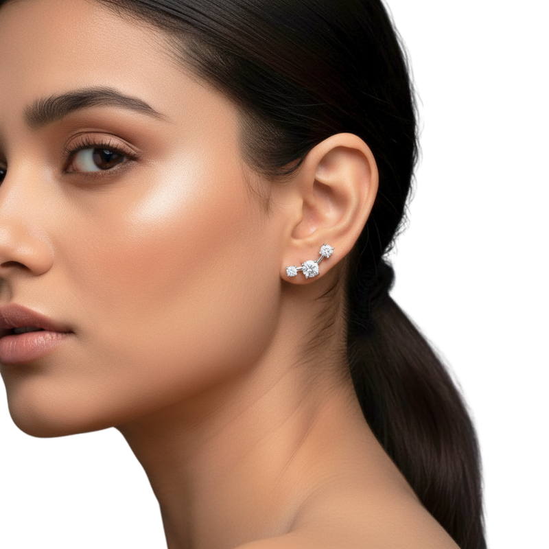 Close-up of a woman wearing diamond earrings on a white background