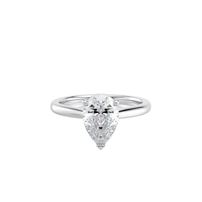 Diamond ring with a pear-shaped center stone on a white background