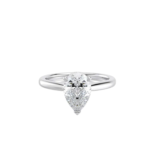 Diamond ring with a pear-shaped center stone on a white background