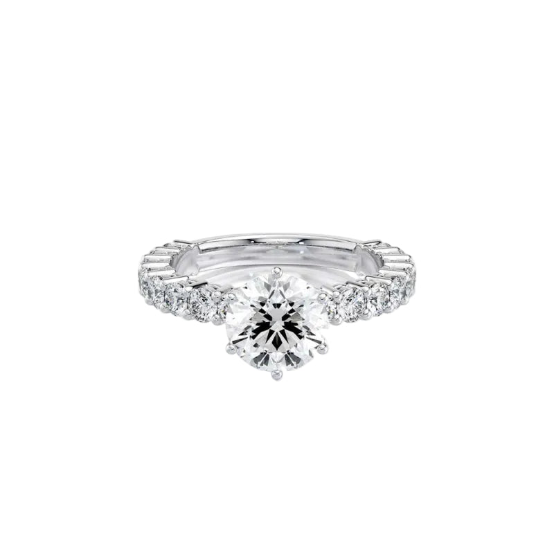An oval-cut diamond solitaire engagement ring set in a polished silver-colored band, shown on a clean white background with a soft reflection.