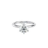 Silver ring with a diamond on a white background