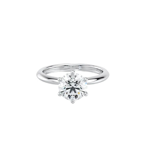 Silver ring with a diamond on a white background