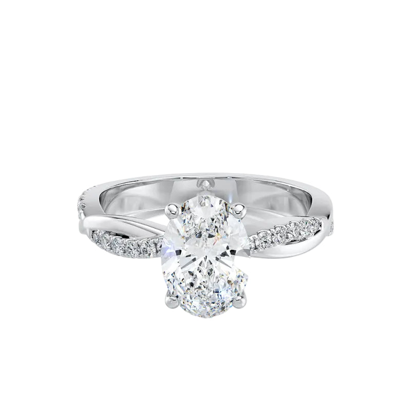 Silver ring with a large diamond and smaller diamonds on the band against a white background