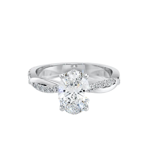 Silver ring with a large diamond and smaller diamonds on the band against a white background