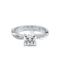 Diamond ring with a white gold band on a white background