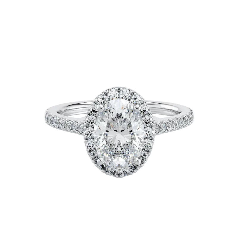 Diamond ring with a central oval-cut diamond and smaller diamonds around on a white background