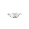 A pear cut diamond solitaire engagement ring in a polished silver-colored metal, shown on a clean white background.