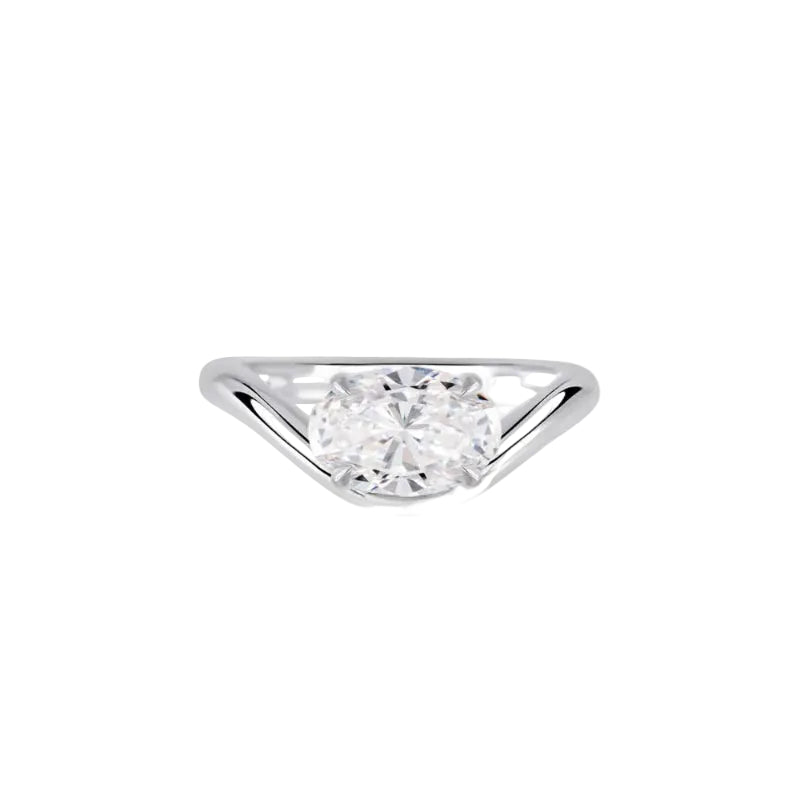 Diamond ring with a triangular setting on a white background