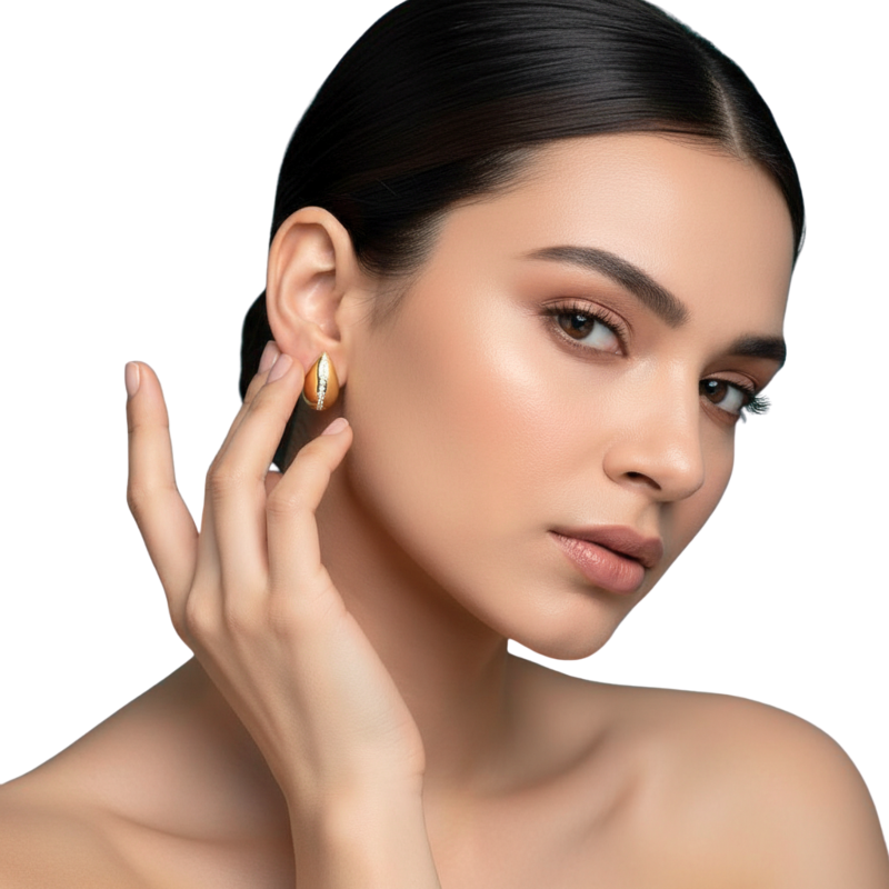 Woman wearing gold earrings on a white background