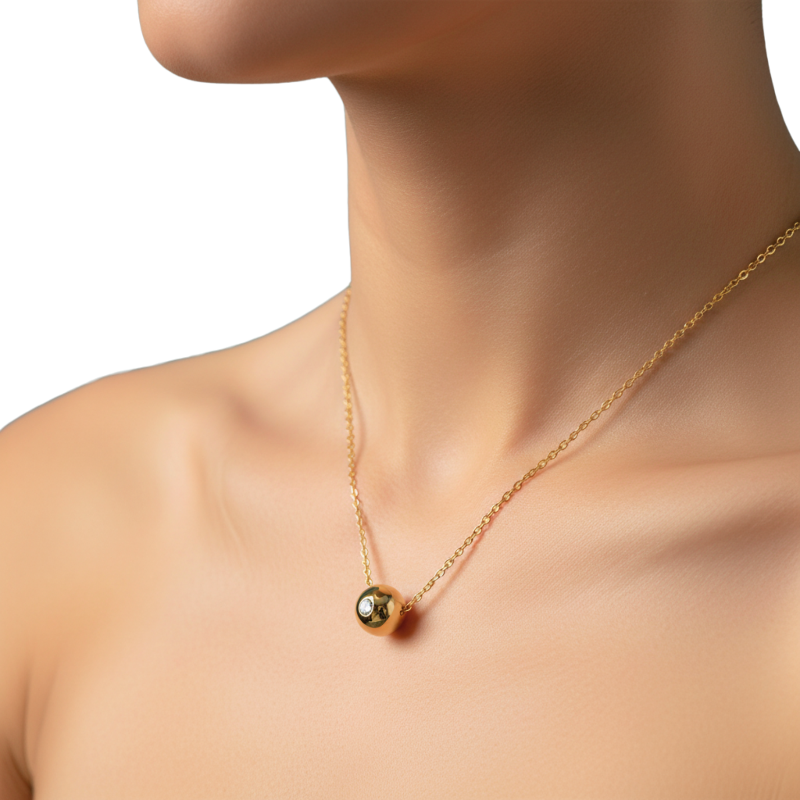 Gold necklace with a pendant on a mannequin