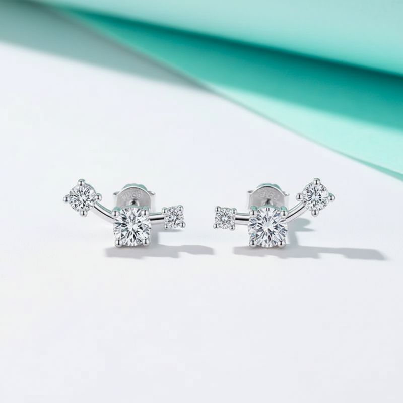 Pair of diamond stud earrings on a light background
