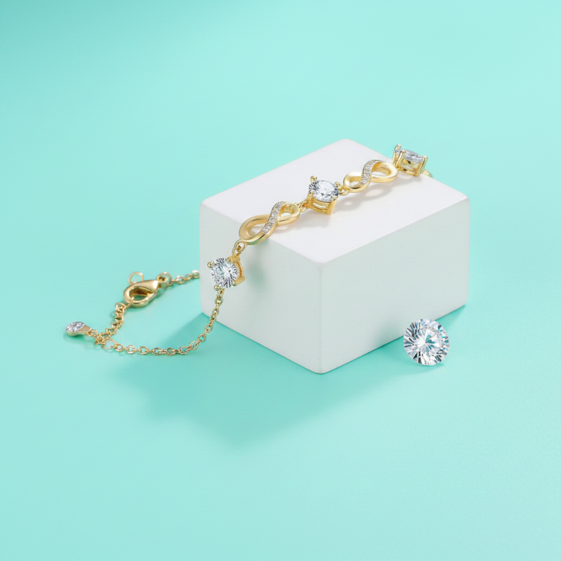Gold bracelet with diamonds on a white block against a light blue background