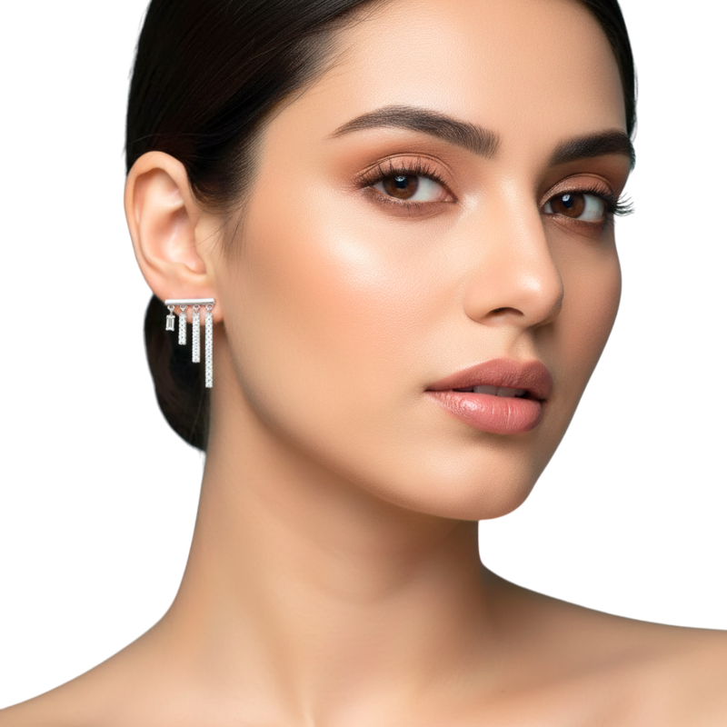 Woman wearing a silver earring on a white background