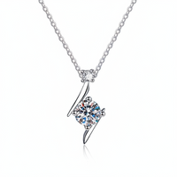 Silver necklace with a diamond pendant on a white background