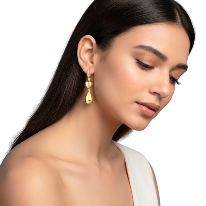 Woman wearing gold earrings on a white background