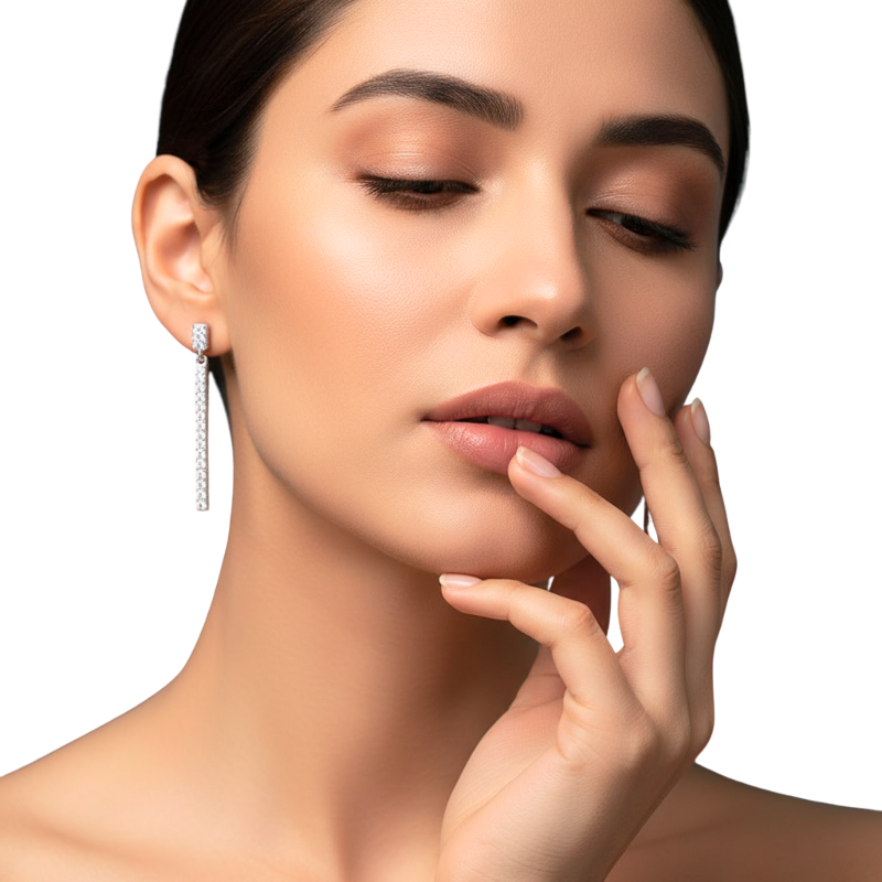 Woman wearing a diamond earring with a neutral background