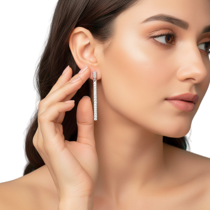 Woman wearing a diamond earring on a white background
