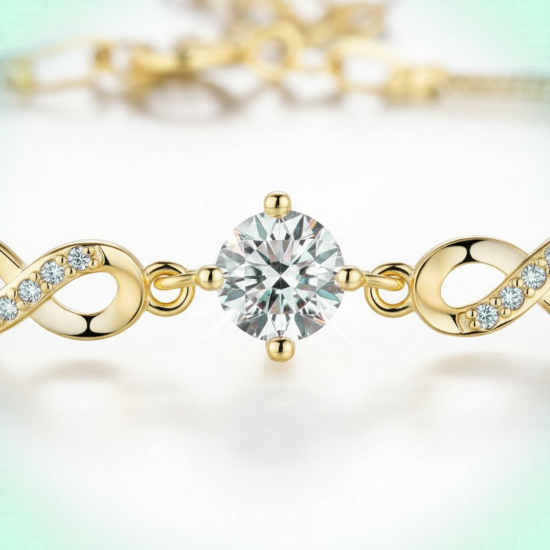 Gold bracelet with a central diamond and infinity symbol design on a light background