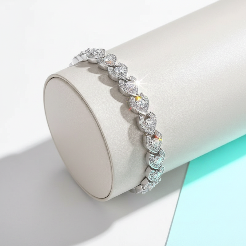 Diamond bracelet on a white cylindrical stand with a light blue background