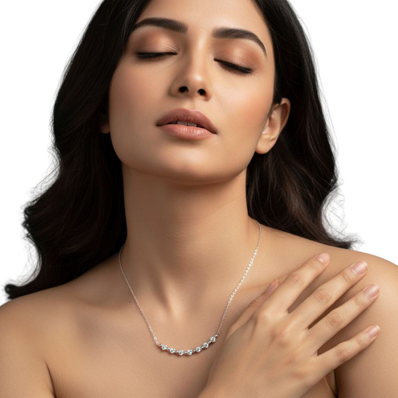 Woman wearing a silver necklace with a clear background