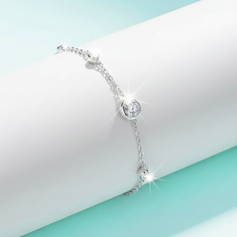 Silver bracelet with a diamond on a light blue and white background