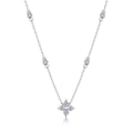 Silver necklace with a star-shaped pendant on a white background