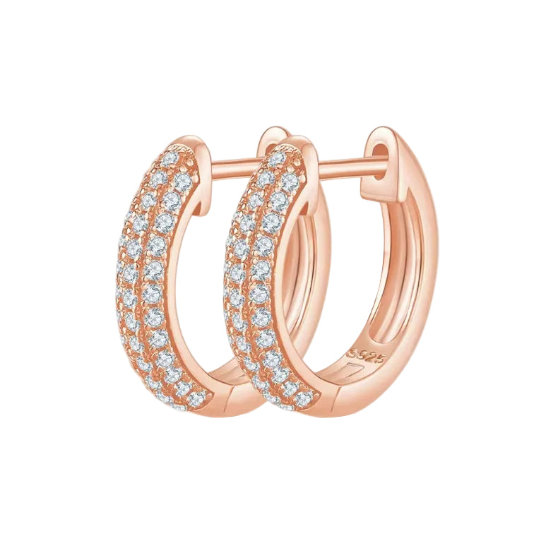 Rose gold hoop earrings with diamond accents on a white background