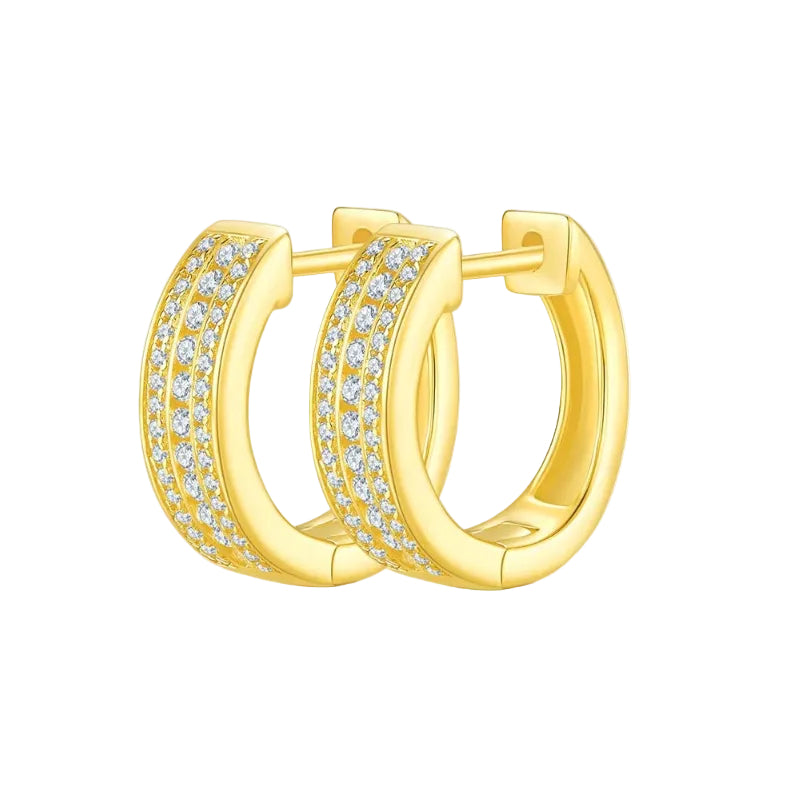 Gold hoop earrings with clear gemstones on a white background