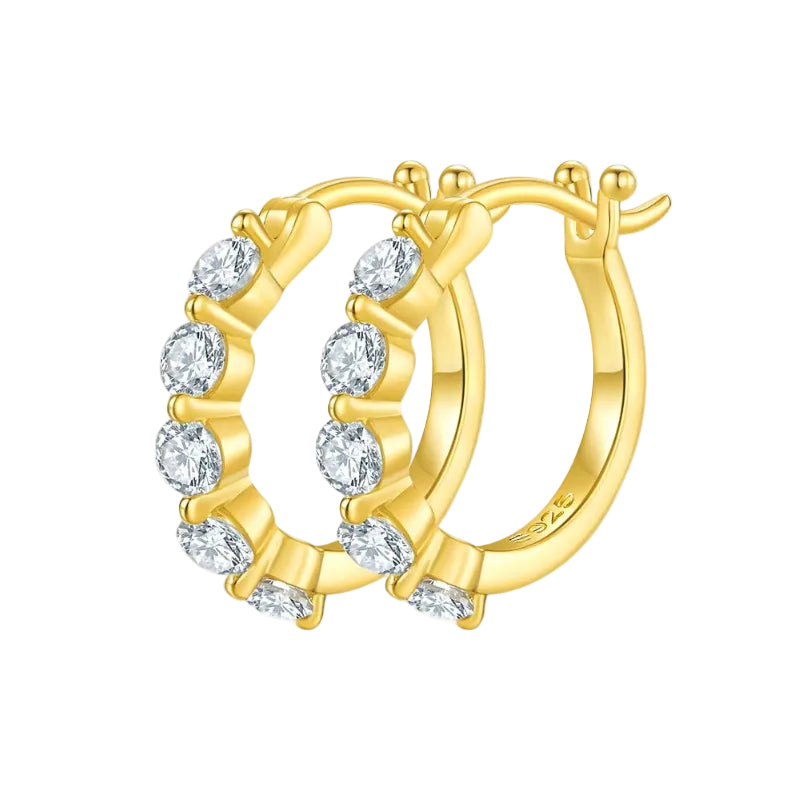 Gold hoop earring with clear gemstones on a white background