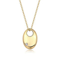 Gold necklace with a round pendant featuring a small diamond on a white background