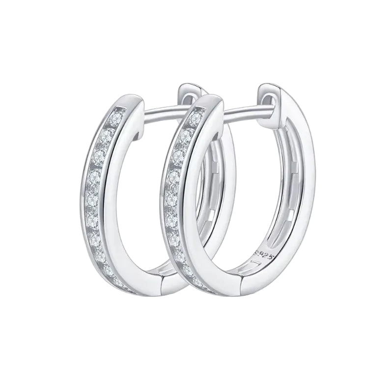 Pair of silver hoop earrings with embedded igi certfied diamond earrings in pakistan on a white background