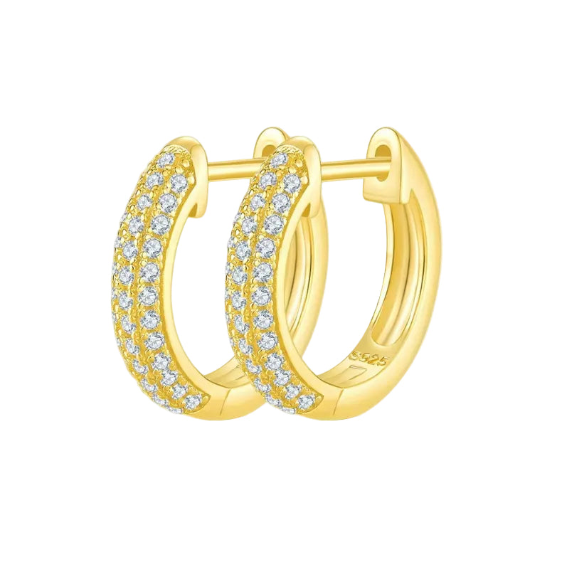 Gold hoop earrings with diamond accents on a white background