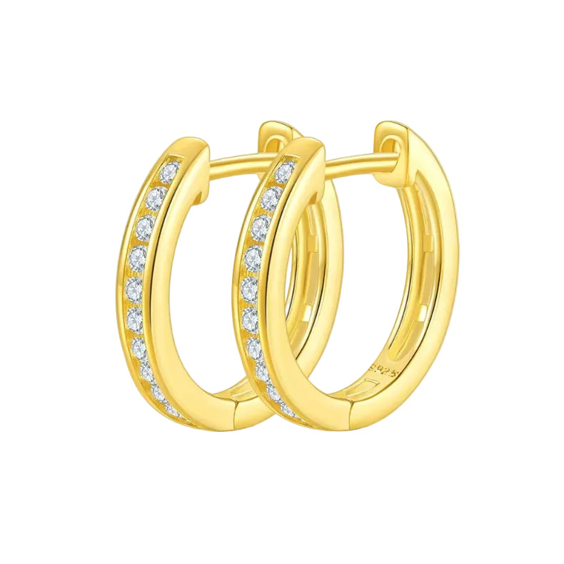 Gold hoop earrings with embedded diamonds on a white background