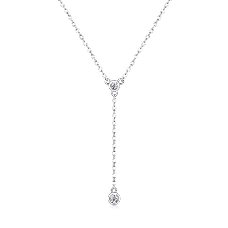 Silver necklace with three round pendants on a white background