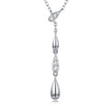 Silver necklace with teardrop-shaped pendants on a white background