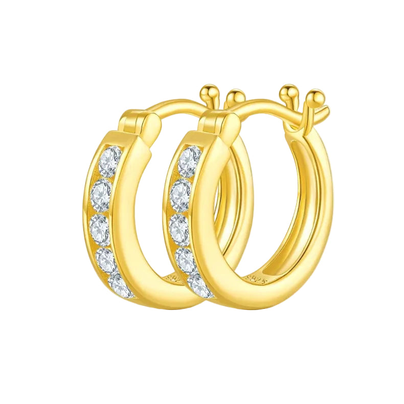 Gold hoop earrings with clear gemstones on a white background