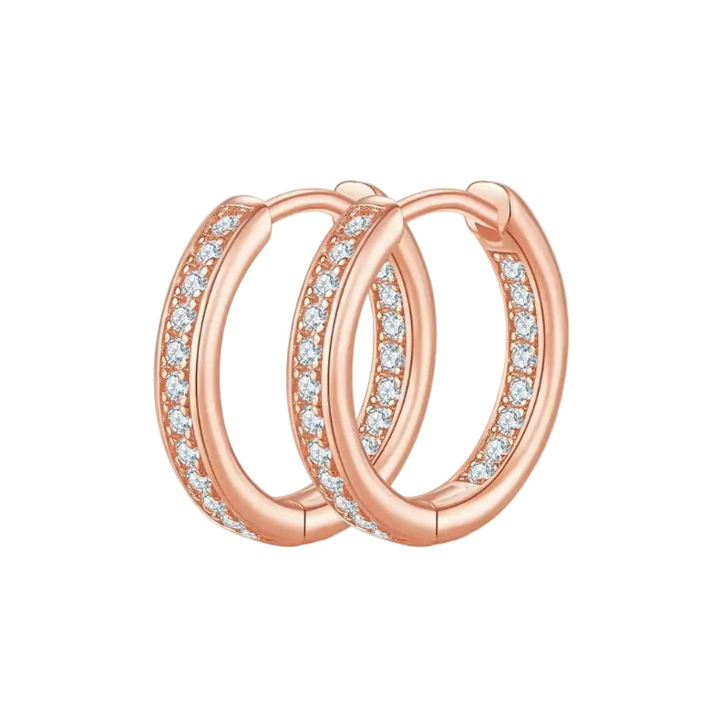 Rose gold hoop earrings with clear gemstones on a white background