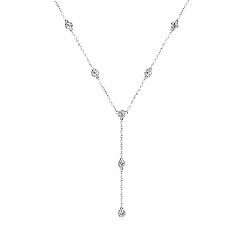 Delicate silver necklace with small diamonds on a white background