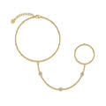 Gold bracelet with heart charm on a white background