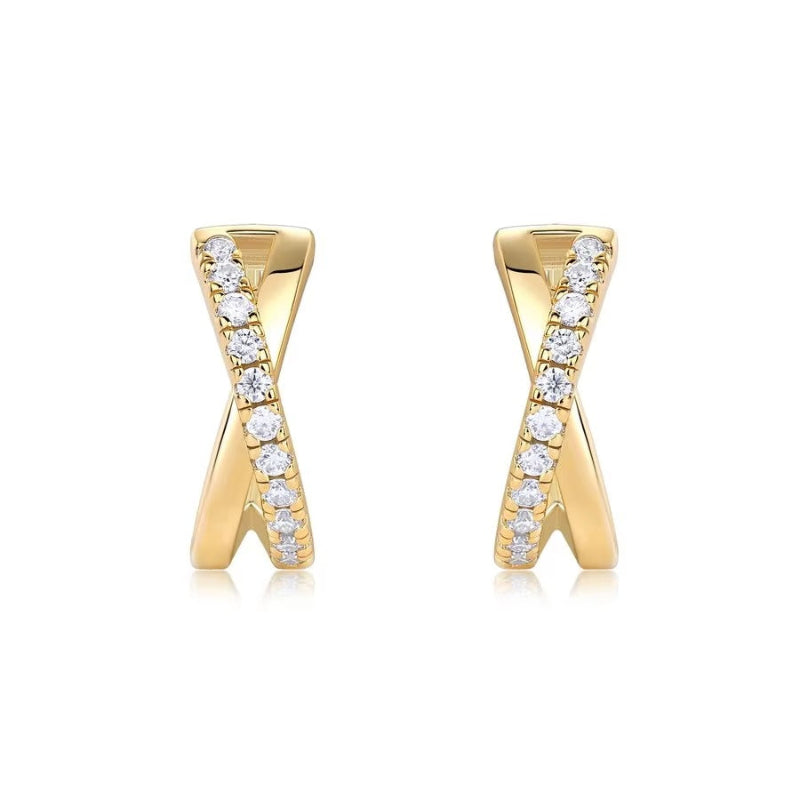 Gold earrings with diamond accents on a white background