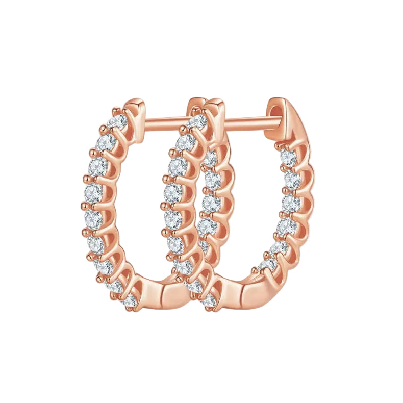 Rose gold hoop earrings with diamonds on a white background