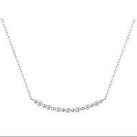 Silver necklace with small diamonds on a white background