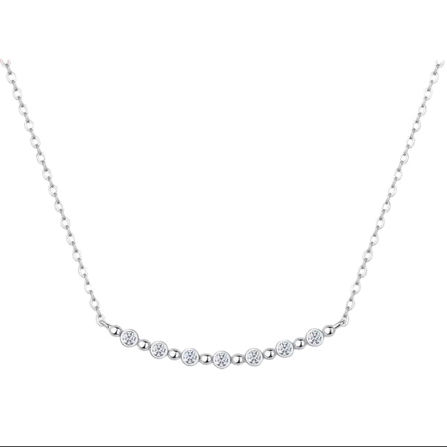 Silver necklace with small diamonds on a white background