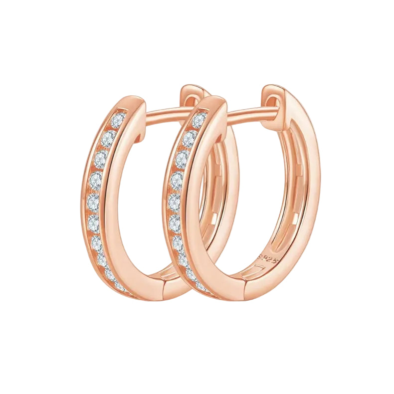 Rose gold hoop earrings with embedded diamonds on a white background