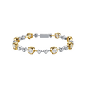 Two-tone gold and silver bracelet with diamond accents on a white background