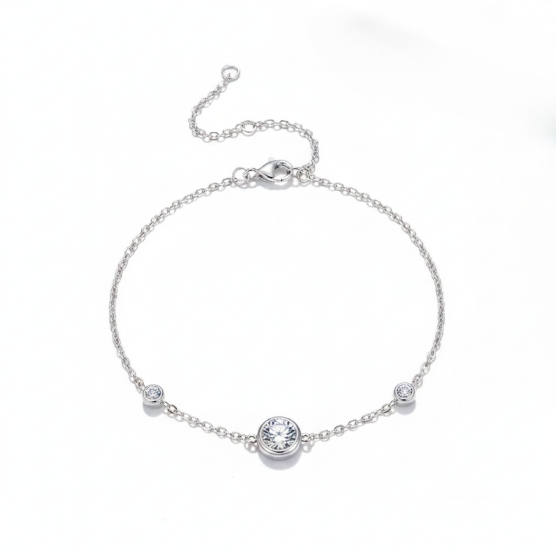 Silver bracelet with small round crystals on a white background